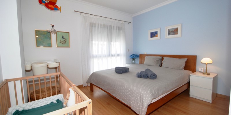 Double Bedroom With Crib In Nazare Holiday Home
