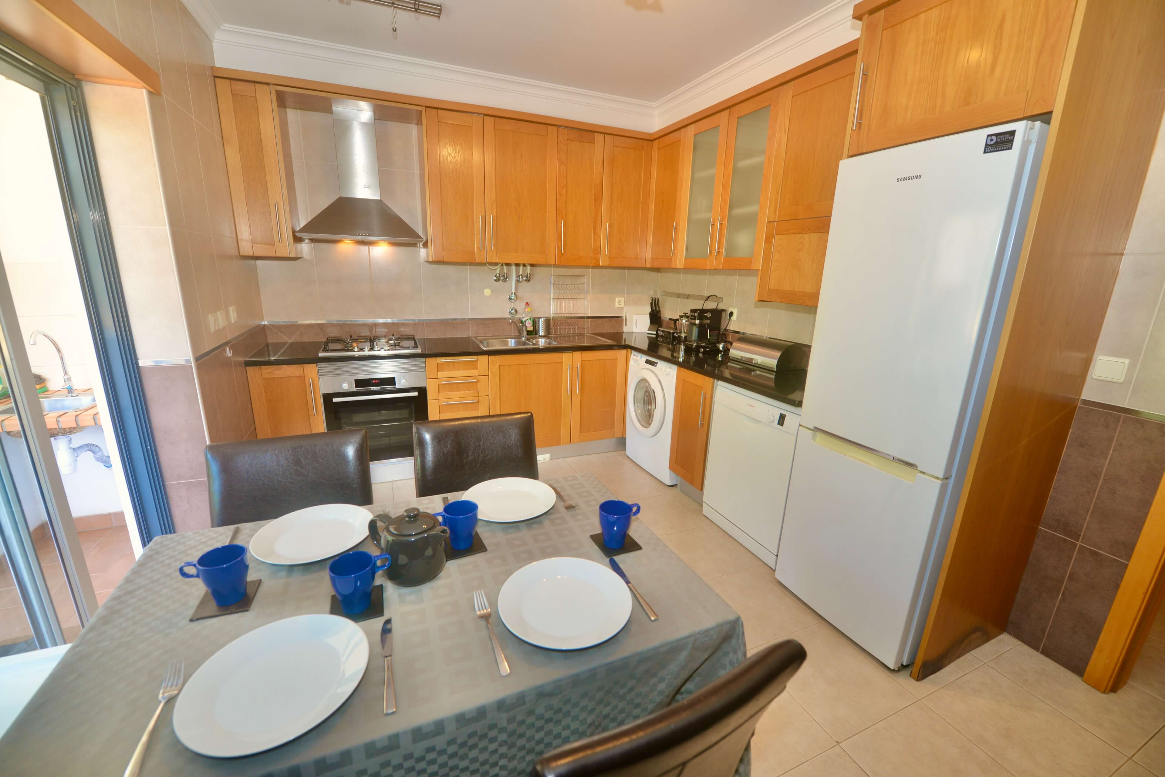 Kitchen And Dining Area In Clementine Apartment Holiday Rental In Nazare Silver Coast Portugal