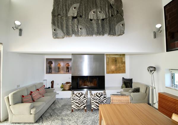 Seating area with fireplace in holiday villa, Lisbon Coast