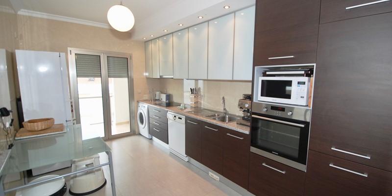 Well Equipped Kitchen With Access To Balcony